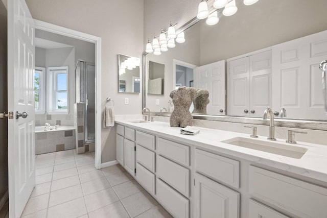6659 Whitemarsh Valley Walk, Austin, TX 78746 - bathroom with double vanity, a garden tub, tile patterned flooring, and a shower stall