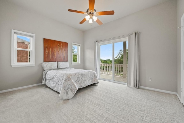 6659 Whitemarsh Valley Walk, Austin, TX 78746 - carpeted bedroom with access to exterior, multiple windows, and ceiling fan