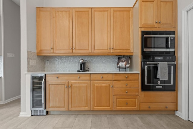 6659 Whitemarsh Valley Walk, Austin, TX 78746 - kitchen with oven, beverage cooler, stainless steel microwave, light countertops, and tasteful backsplash