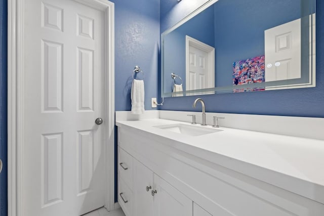 6659 Whitemarsh Valley Walk, Austin, TX 78746 - bathroom featuring vanity and marble look tile flooring
