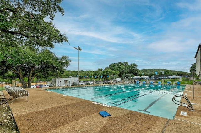 6659 Whitemarsh Valley Walk, Austin, TX 78746 - community pool featuring a patio