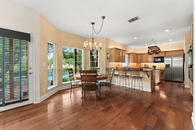 dining space with visible vents, baseboards, a chandelier, recessed lighting, and dark wood-type flooring