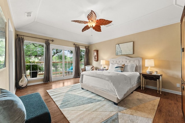 bedroom featuring a ceiling fan, access to exterior, wood finished floors, and visible vents