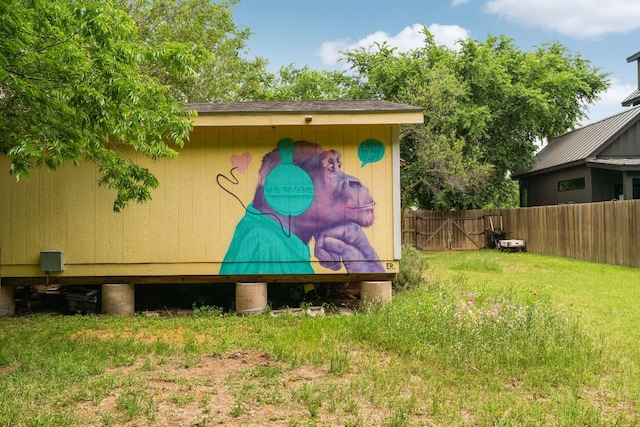view of outdoor structure featuring fence