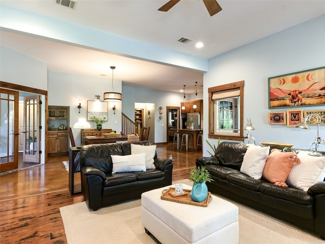 19904 Victoria Chase Rd, Lago Vista, TX 78645 - living area featuring wood finished floors, stairway, a ceiling fan, recessed lighting, and french doors
