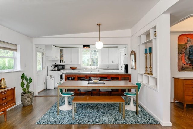 5323 Downs Dr, Austin, TX 78721 - dining space featuring dark wood finished floors