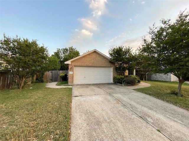 1709 Bush Coat Ln, Austin, TX 78754 - view of front facade with driveway, a garage, and brick siding