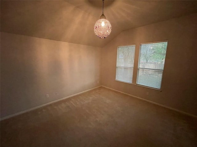 1709 Bush Coat Ln, Austin, TX 78754 - spare room featuring vaulted ceiling, carpet floors, and a chandelier