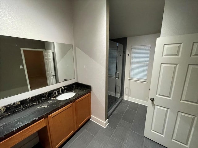 1709 Bush Coat Ln, Austin, TX 78754 - full bathroom with a shower stall, vanity, tile patterned flooring, and a textured wall
