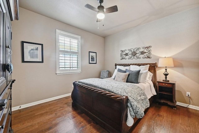 bedroom with wood finished floors, a ceiling fan, and baseboards
