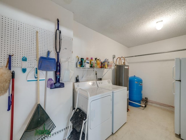 620 Lake Island Dr, Canyon Lake, TX 78133 - laundry area featuring washer and clothes dryer, a textured ceiling, water heater, light colored carpet, and laundry area