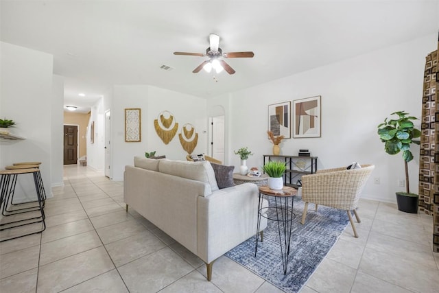 1812 Hidden Springs Path, Round Rock, TX 78665 - living area featuring a ceiling fan, light tile patterned flooring, arched walkways, baseboards, and visible vents