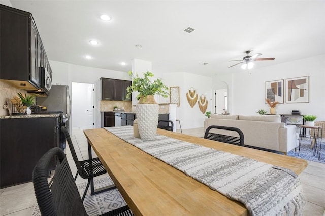 1812 Hidden Springs Path, Round Rock, TX 78665 - dining room featuring recessed lighting, visible vents, light tile patterned flooring, arched walkways, and ceiling fan