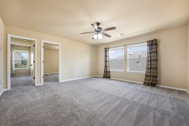 1812 Hidden Springs Path, Round Rock, TX 78665 - carpeted empty room with visible vents, a ceiling fan, baseboards, and a healthy amount of sunlight