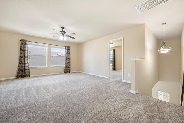 1812 Hidden Springs Path, Round Rock, TX 78665 - empty room with plenty of natural light, visible vents, and light colored carpet