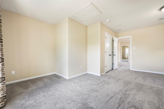 1812 Hidden Springs Path, Round Rock, TX 78665 - carpeted spare room featuring attic access and baseboards