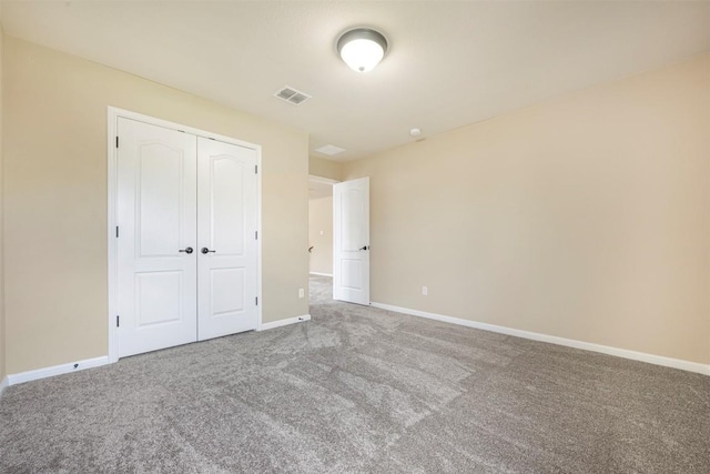 1812 Hidden Springs Path, Round Rock, TX 78665 - unfurnished bedroom with baseboards, carpet flooring, visible vents, and a closet
