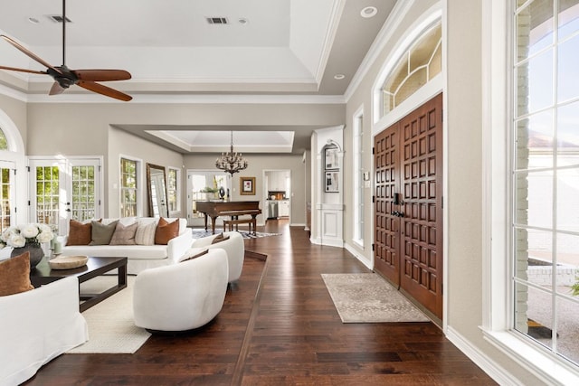 5710 Carry Back Ln, Austin, TX 78746 - living area featuring a raised ceiling, crown molding, dark wood-type flooring, a ceiling fan, and a chandelier