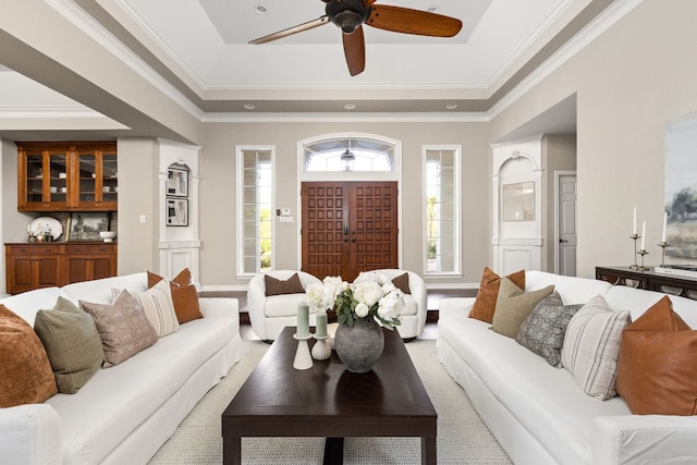 5710 Carry Back Ln, Austin, TX 78746 - living area with a ceiling fan, a raised ceiling, ornamental molding, and baseboards