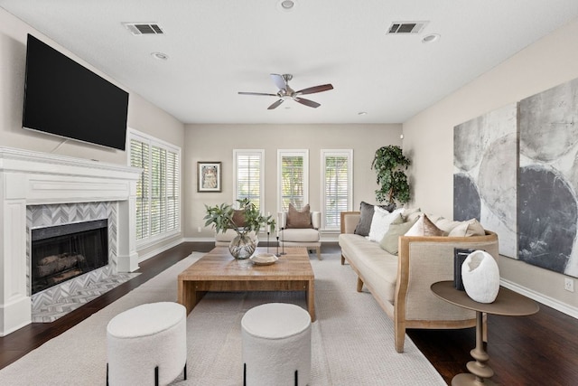 5710 Carry Back Ln, Austin, TX 78746 - living area with a ceiling fan, a tiled fireplace, wood finished floors, recessed lighting, and baseboards