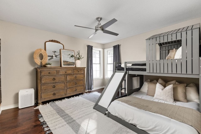 5710 Carry Back Ln, Austin, TX 78746 - bedroom with baseboards, wood finished floors, and a ceiling fan