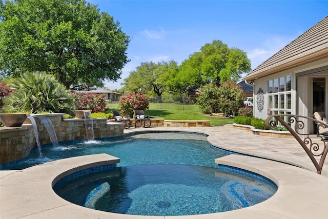 27435 Waterfall Hill Pkwy, Spicewood, TX 78669 - view of pool featuring a yard, fence private yard, a patio, and a pool with connected hot tub