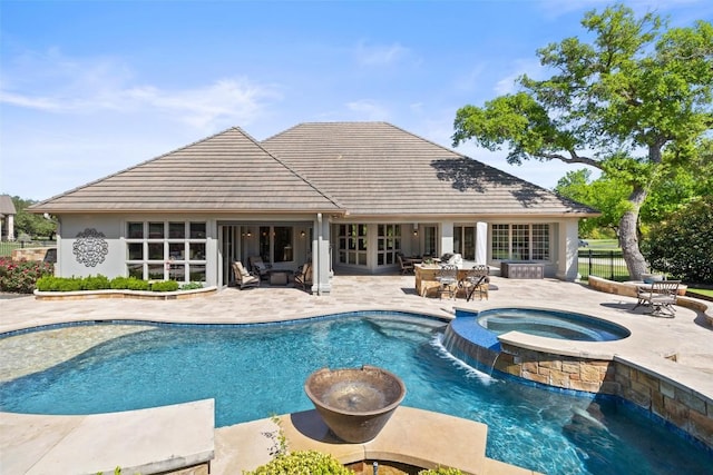 27435 Waterfall Hill Pkwy, Spicewood, TX 78669 - view of swimming pool featuring outdoor dining area, a patio, french doors, and a pool with connected hot tub