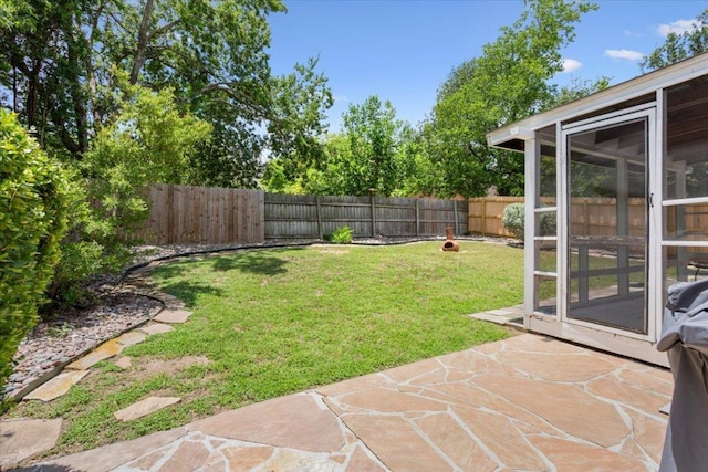 2203 Nathan Dr, Austin, TX 78728 - fenced backyard with a patio area and a sunroom