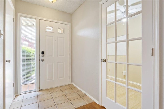 2203 Nathan Dr, Austin, TX 78728 - entrance foyer featuring light tile patterned floors and baseboards