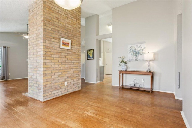 2203 Nathan Dr, Austin, TX 78728 - living area with ceiling fan, wood finished floors, and a textured ceiling