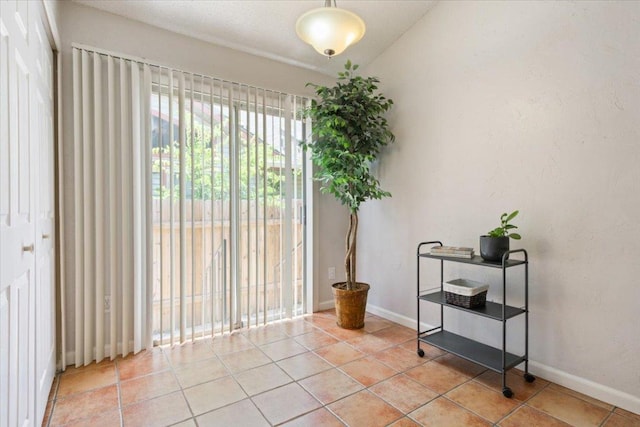 2203 Nathan Dr, Austin, TX 78728 - empty room featuring light tile patterned floors and baseboards