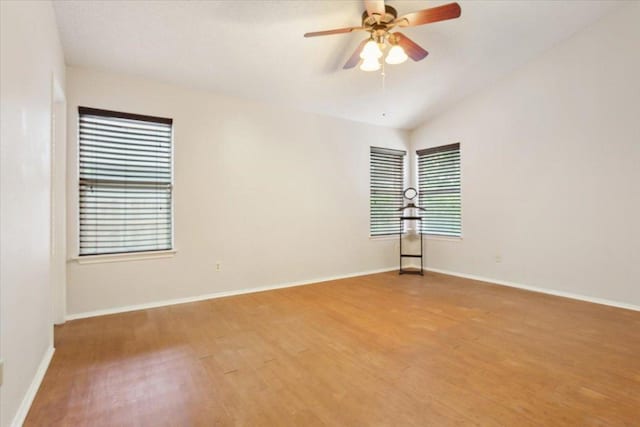 2203 Nathan Dr, Austin, TX 78728 - spare room featuring wood finished floors, ceiling fan, and vaulted ceiling