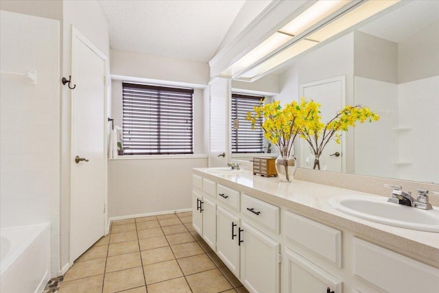2203 Nathan Dr, Austin, TX 78728 - bathroom featuring double vanity and tile patterned floors