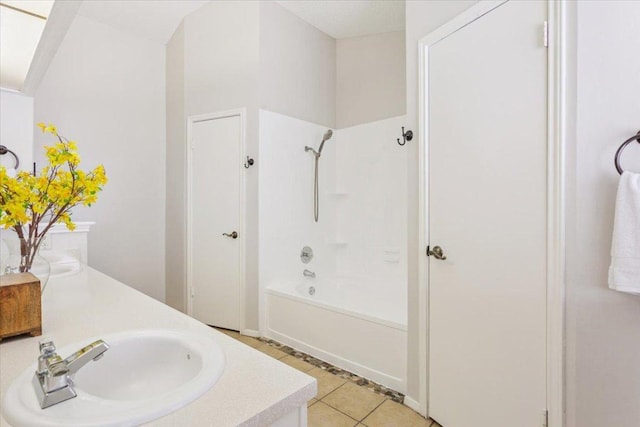 2203 Nathan Dr, Austin, TX 78728 - full bath with double vanity, tile patterned floors, and shower / bath combination