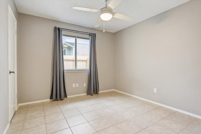 2203 Nathan Dr, Austin, TX 78728 - empty room featuring ceiling fan, a textured ceiling, and light tile patterned flooring