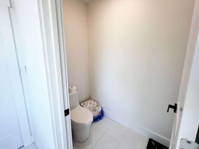 bathroom with tile patterned floors and toilet