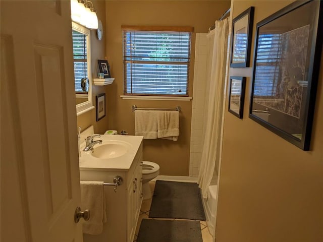 bathroom featuring vanity, baseboards, shower / tub combo, toilet, and tile patterned flooring