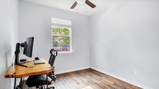 1837 Artesian Springs Xing, Leander, TX 78641 - office with baseboards, wood finished floors, and a ceiling fan