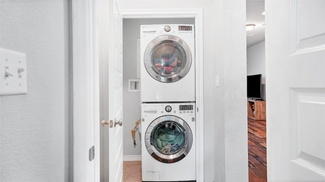 1837 Artesian Springs Xing, Leander, TX 78641 - clothes washing area with stacked washer / drying machine, wood finished floors, and laundry area