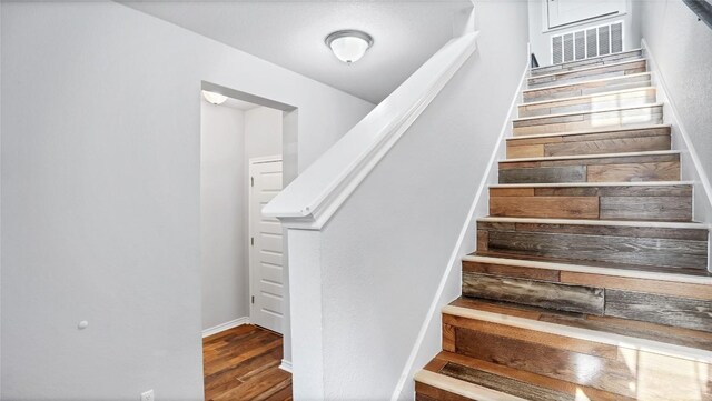 1837 Artesian Springs Xing, Leander, TX 78641 - stairway featuring wood finished floors and baseboards