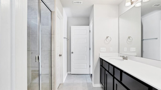 1837 Artesian Springs Xing, Leander, TX 78641 - full bathroom featuring visible vents, vanity, tile patterned flooring, and a stall shower