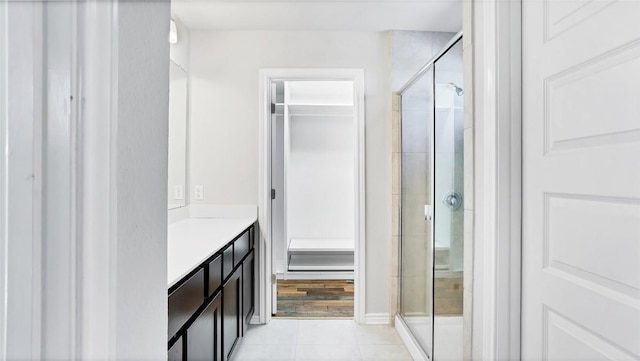 1837 Artesian Springs Xing, Leander, TX 78641 - bathroom with tile patterned floors, vanity, and a shower stall