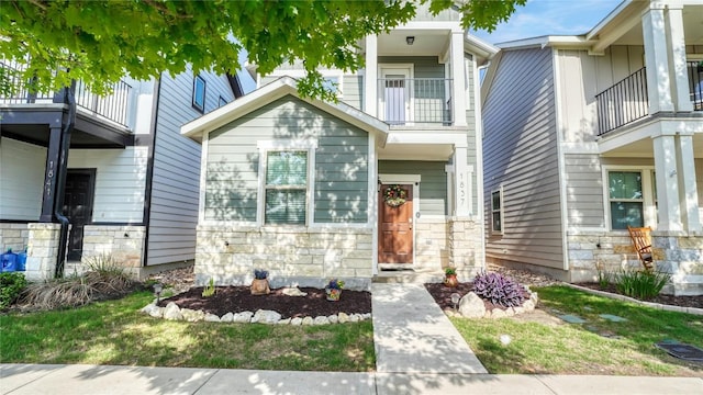 1837 Artesian Springs Xing, Leander, TX 78641 - view of property featuring stone siding and a balcony