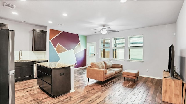 1837 Artesian Springs Xing, Leander, TX 78641 - interior space with recessed lighting, light wood finished floors, visible vents, a ceiling fan, and baseboards