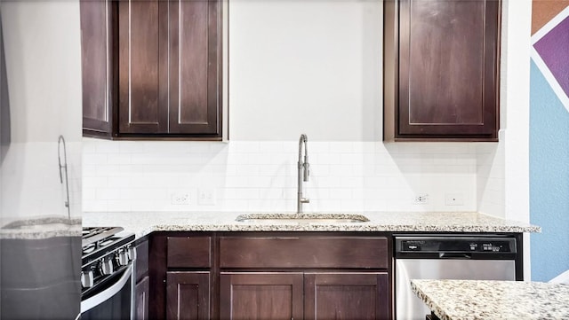1837 Artesian Springs Xing, Leander, TX 78641 - kitchen with stainless steel dishwasher, dark brown cabinets, a sink, and range with gas cooktop