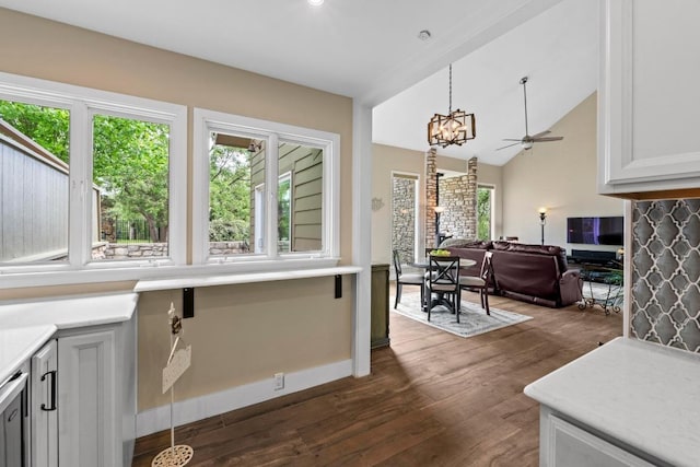 9 Stoney Creek Cv, Lakeway, TX 78734 - kitchen with plenty of natural light, dark wood-style floors, a chandelier, open floor plan, and lofted ceiling