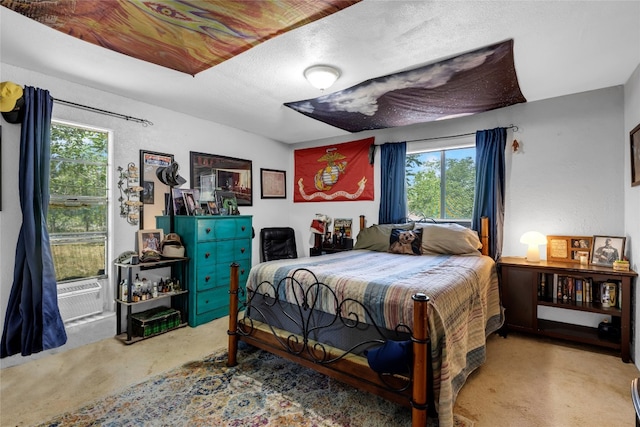 bedroom with cooling unit and carpet flooring