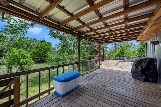 wooden deck with grilling area