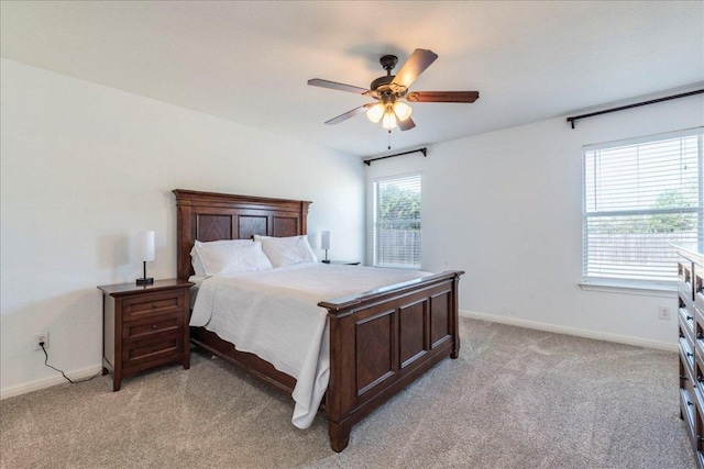 219 Quarry Ln, Liberty Hill, TX 78642 - bedroom featuring light colored carpet, baseboards, and a ceiling fan