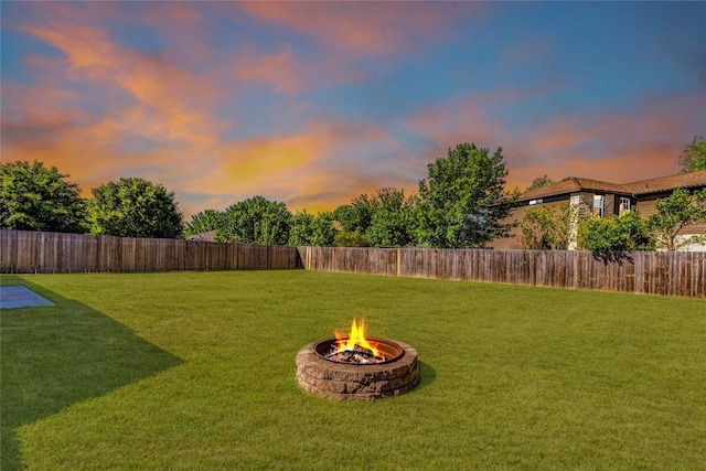 219 Quarry Ln, Liberty Hill, TX 78642 - view of yard with a fenced backyard and an outdoor fire pit